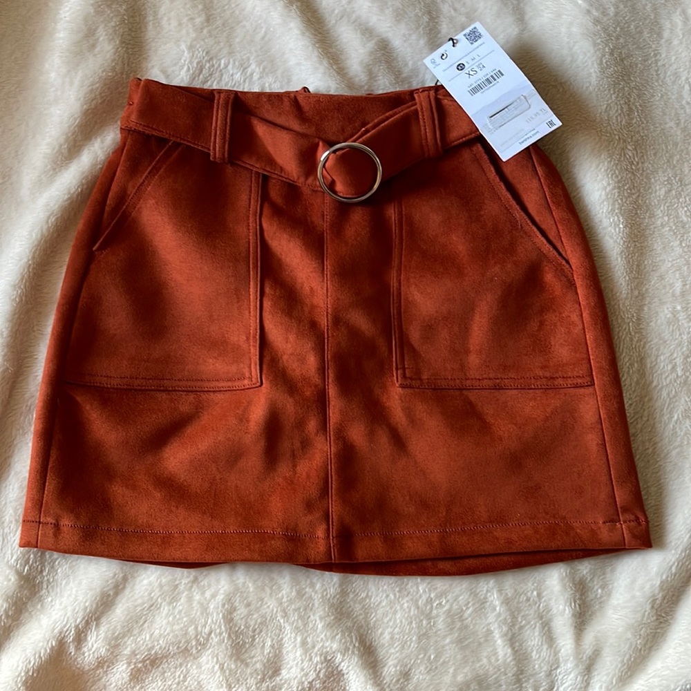 Bershka brand. Kind of like red brick color. Faıx suede. Never worn.